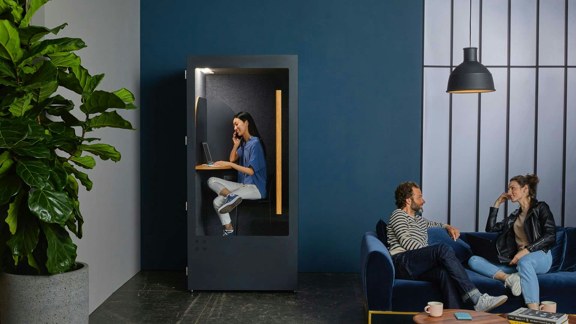Thee Millennial Coworkers in Modern Office Setting